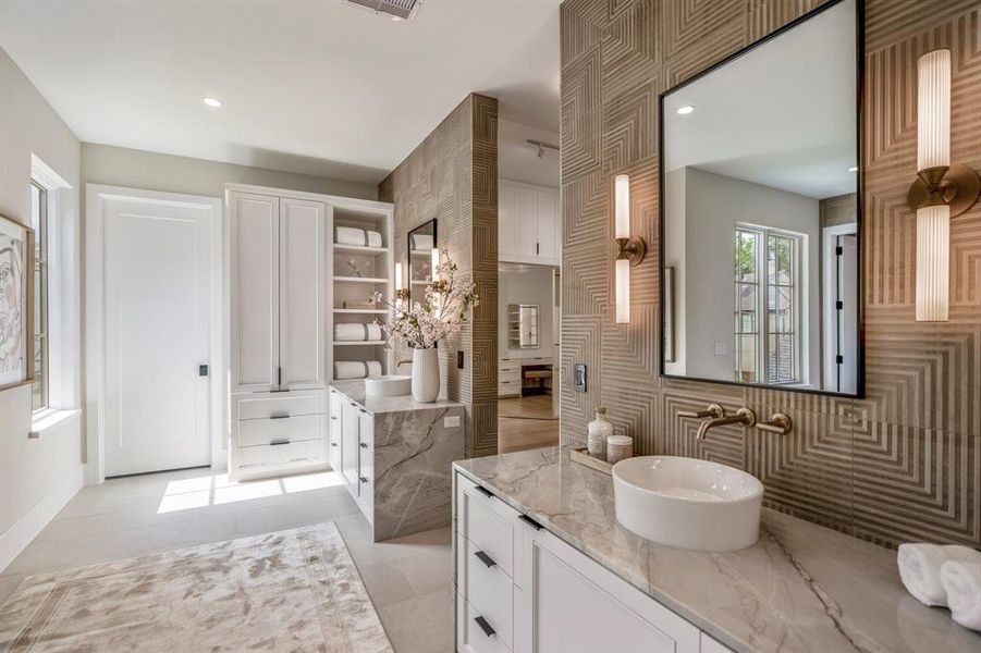 Luxury abounds, including 2 water closets and...