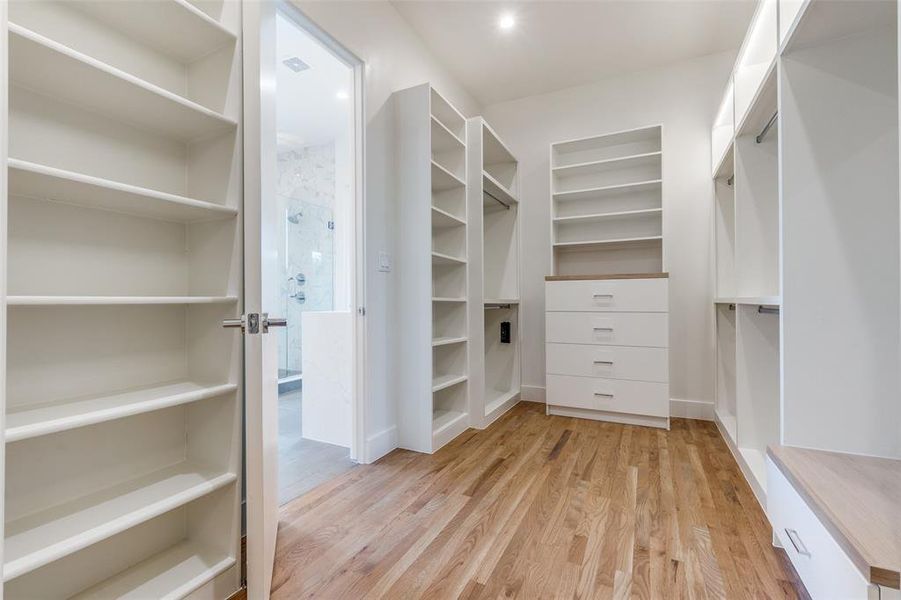 Large primary closet with tons of built-ins