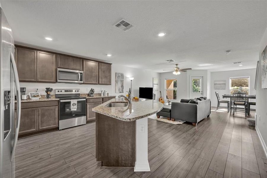 Every chef's dream kitchen with plenty of counter space with gray granite countertops