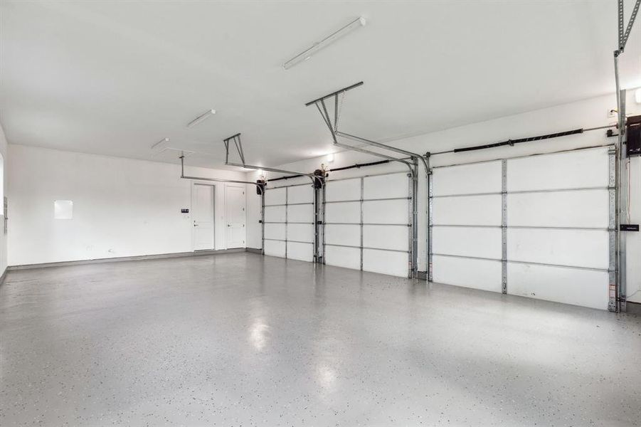 3 car garage with epoxy floors.