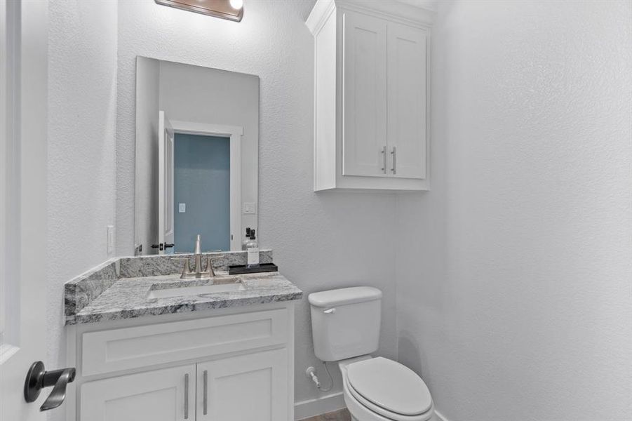 Bathroom featuring vanity and toilet