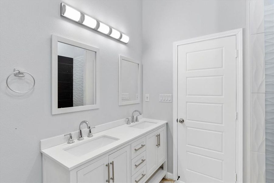Bathroom featuring double vanity
