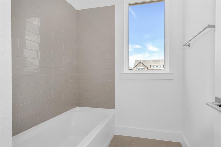 Bathroom with tile patterned floors