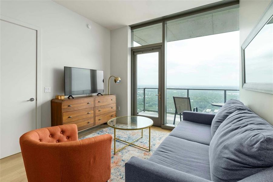 Open floor plan with floor to ceiling windows with vies of downtown and Lady Bird Lake