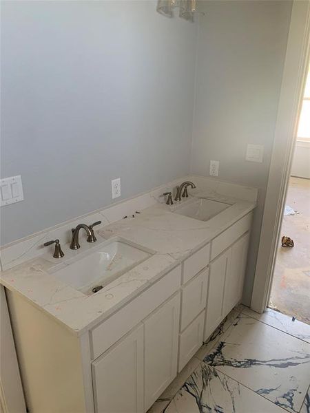 Bathroom with vanity and a wealth of natural light