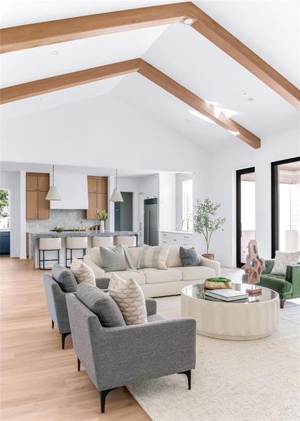 Living room with light hardwood / wood-style floors, beam ceiling, and high vaulted ceiling