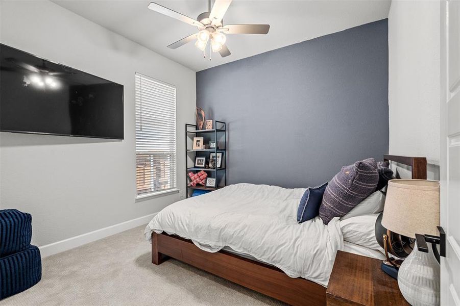 Bedroom with carpet and ceiling fan