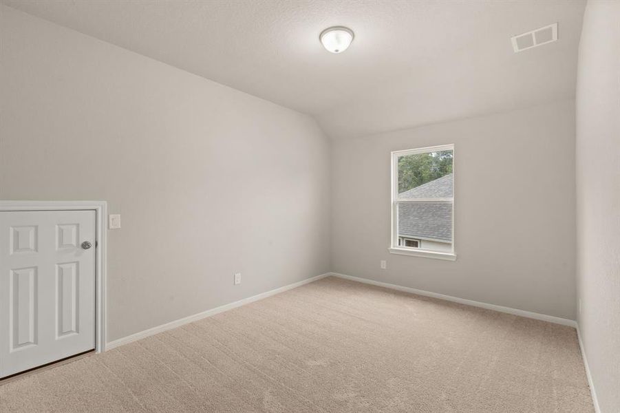 Your secondary bedroom features plush carpet, fresh paint, closet, and a large window that lets in plenty of natural lighting.