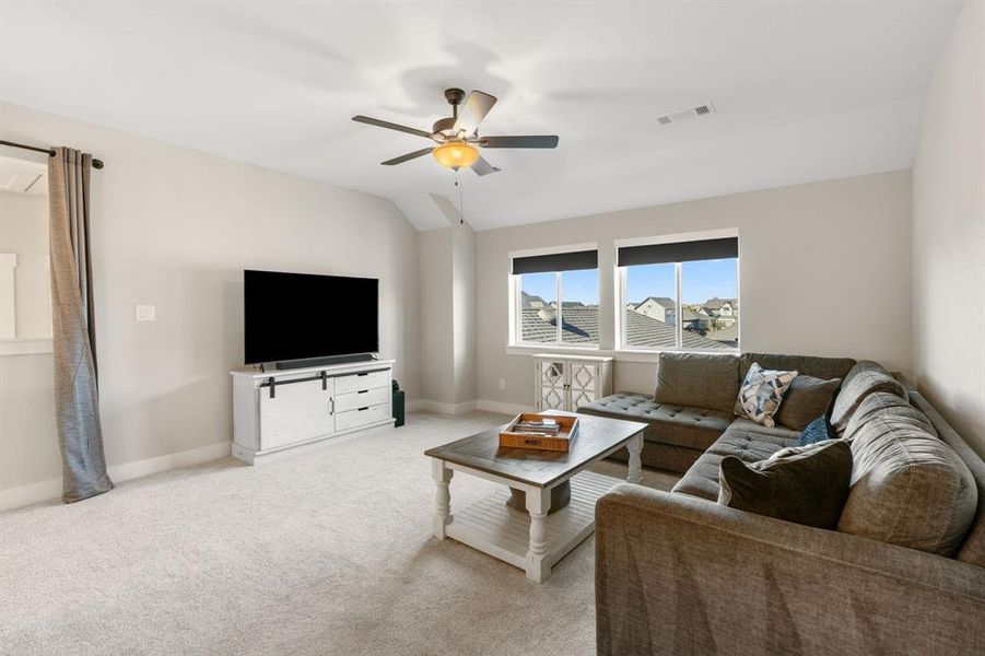 Another view of the game room.  Owner has installed black out drapes all along the open areas.  Perfect for movie watching night!