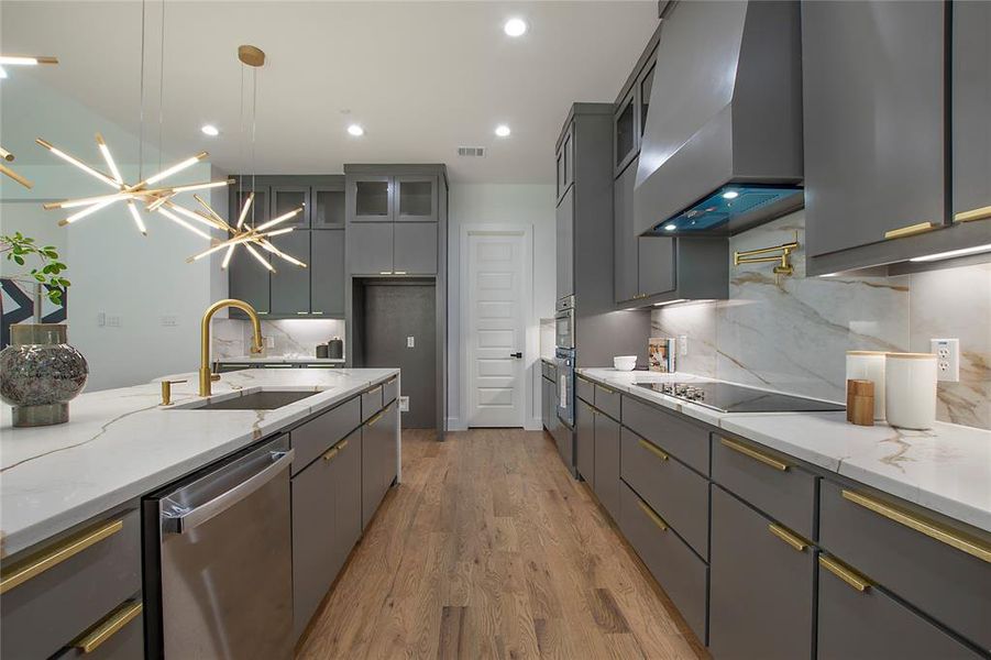 Kitchen featuring black electric cooktop, tasteful backsplash, dishwasher, wall chimney exhaust hood, and sink