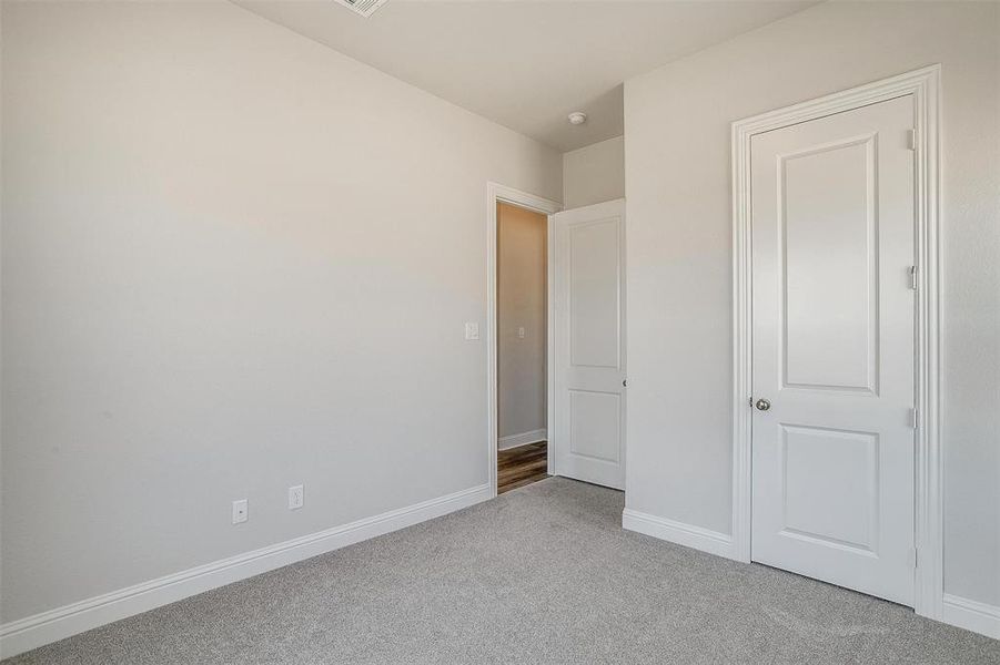 Unfurnished bedroom featuring carpet