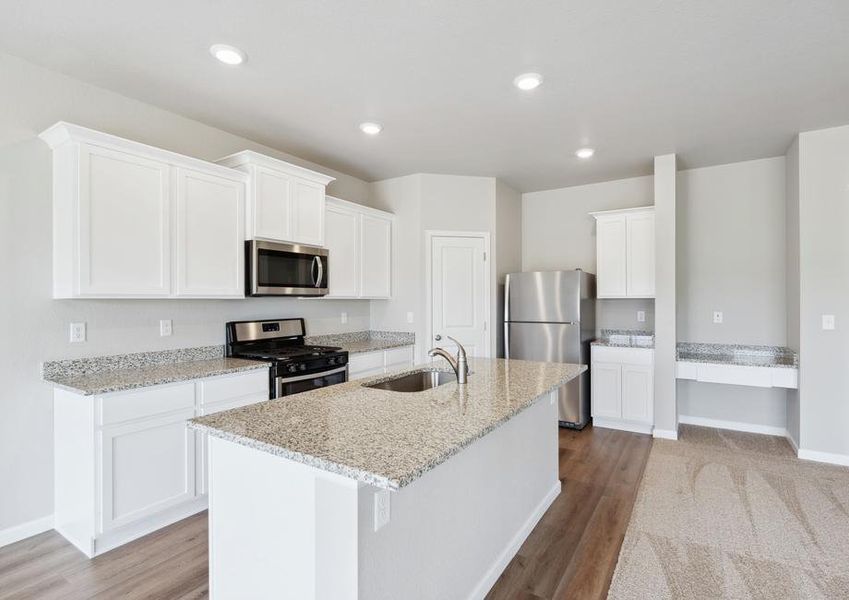 The kitchen in the Pike has beautiful, granite countertops.