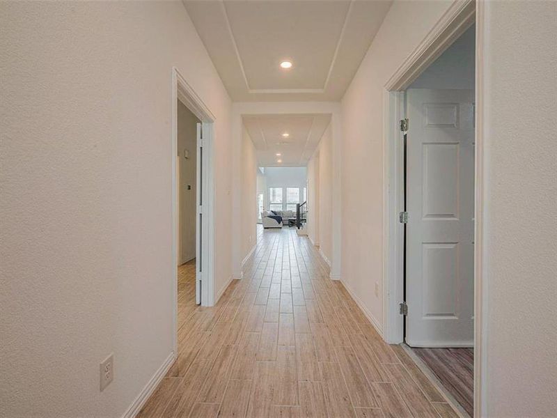 This clean and tidy hallway suggests a home that is well-cared for.