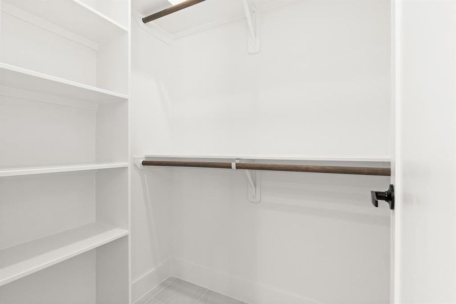 Another view of CMC's secondary closet that also includes custom shelf.