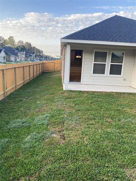 Nice sodded yard, fence has side access gate.