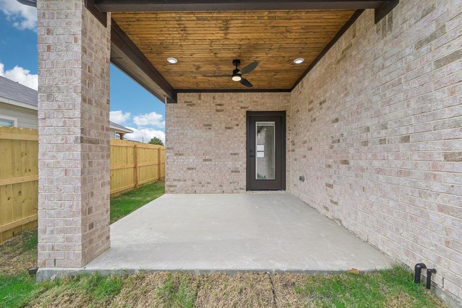 View of patio featuring ceiling fan