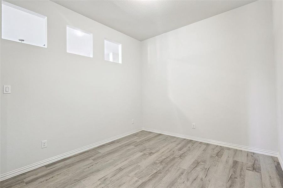 Spare room with light hardwood / wood-style floors