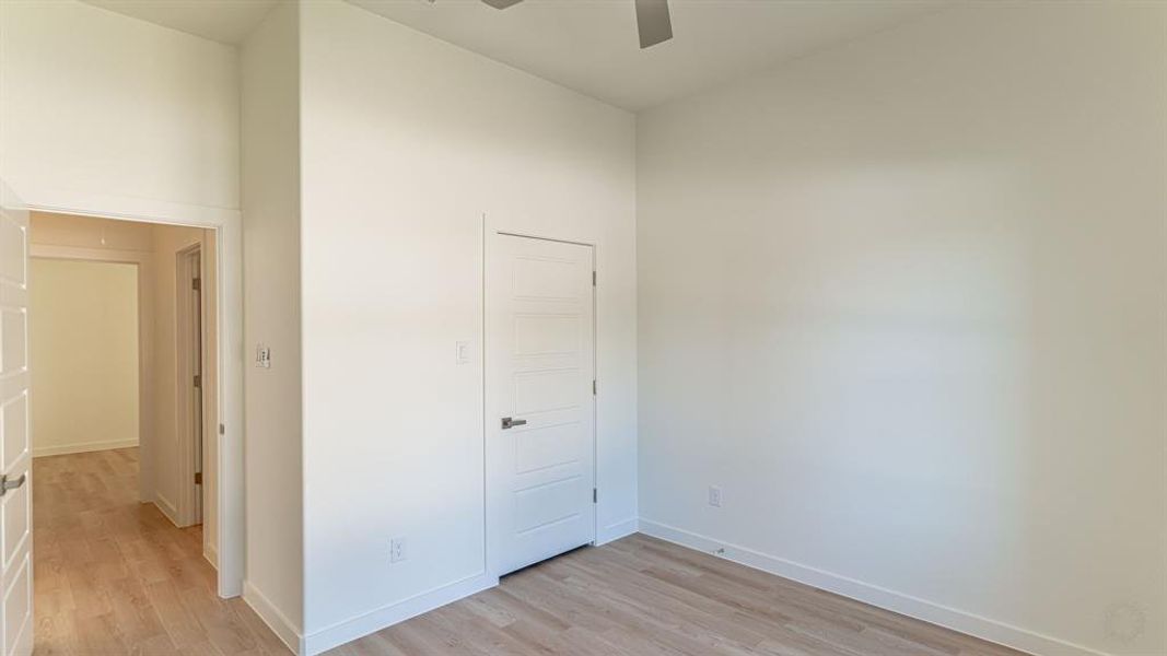 Secondary bedroom with walk in closet