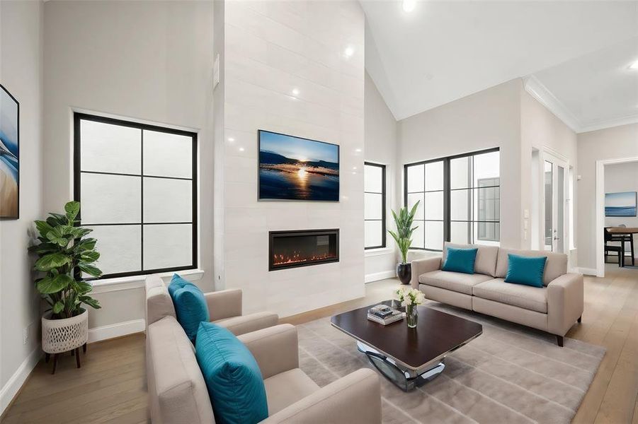 Main living area providing the finest in open concept living.  The space is thoroughly washed with sunlight from the wall of windows overlooking the court yard (virtual staged)