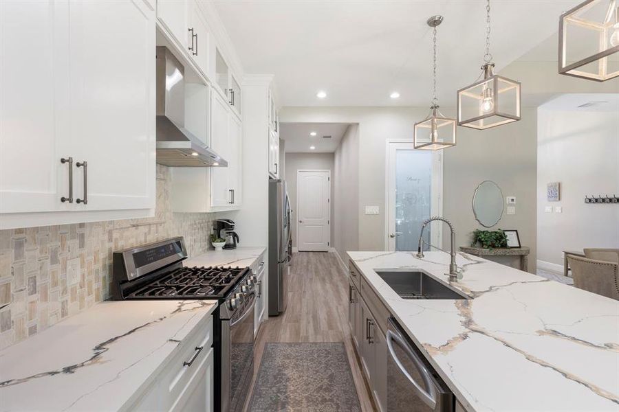 A beautiful, functional layout to cook and enjoy dinner together. All appliances are stainless steel and LED lighting throughout is customizable to your color preference (warm or cool lighting).