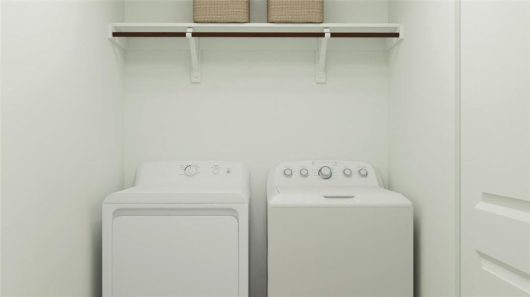 Laundry room featuring washing machine and clothes dryer