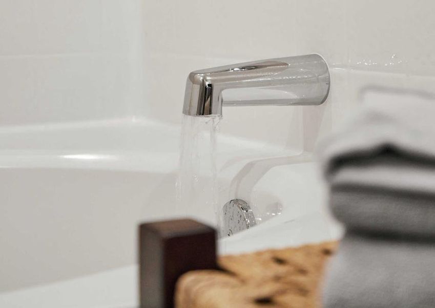 Close up of a soaking tub with running water.