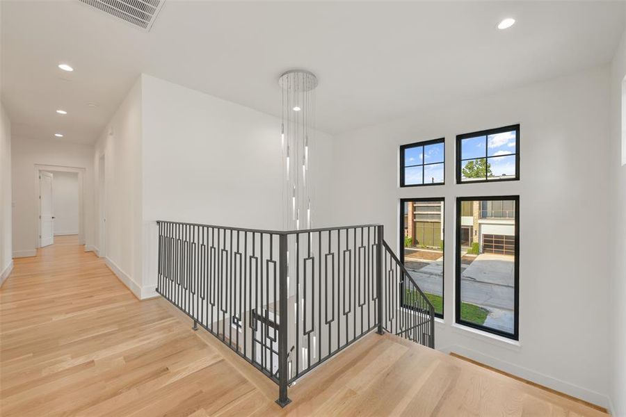 The upstairs landing leads to a wide corridor accessing the Game/media room, three secondary bedrooms each with an ensuite bath and the large utility room.