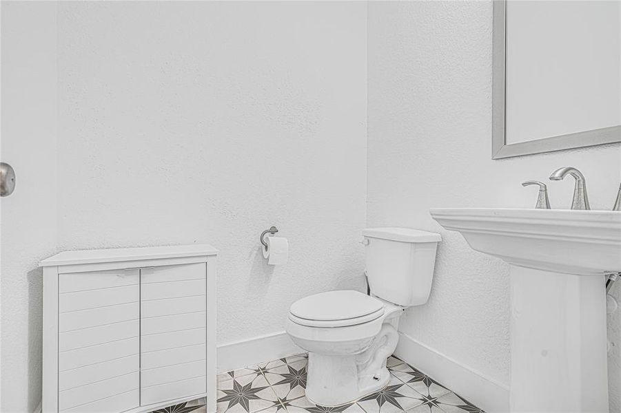 Style meets practicality in a compact yet inviting half bathroom.