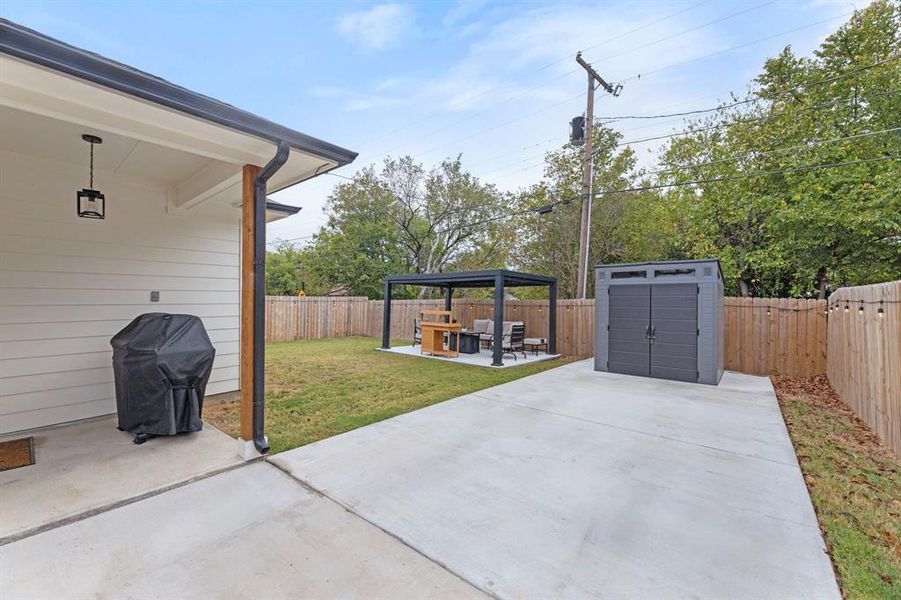 View of patio / terrace featuring a gazebo and a grill