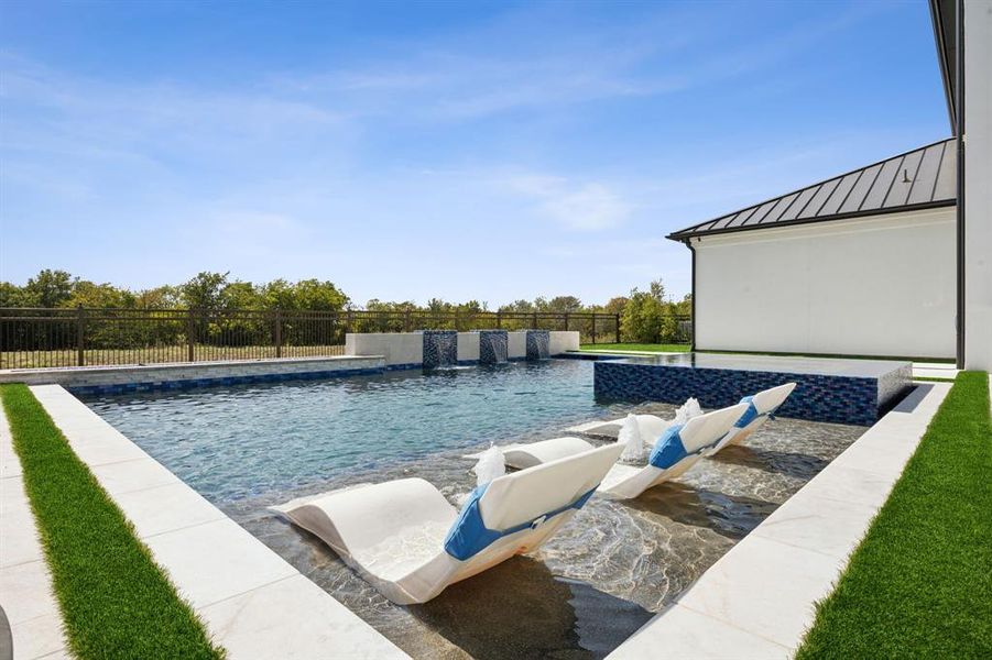 View of pool featuring pool water feature