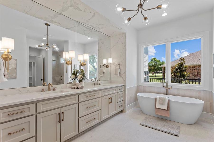 Primary bathroom with high end fixtures and stone selections.