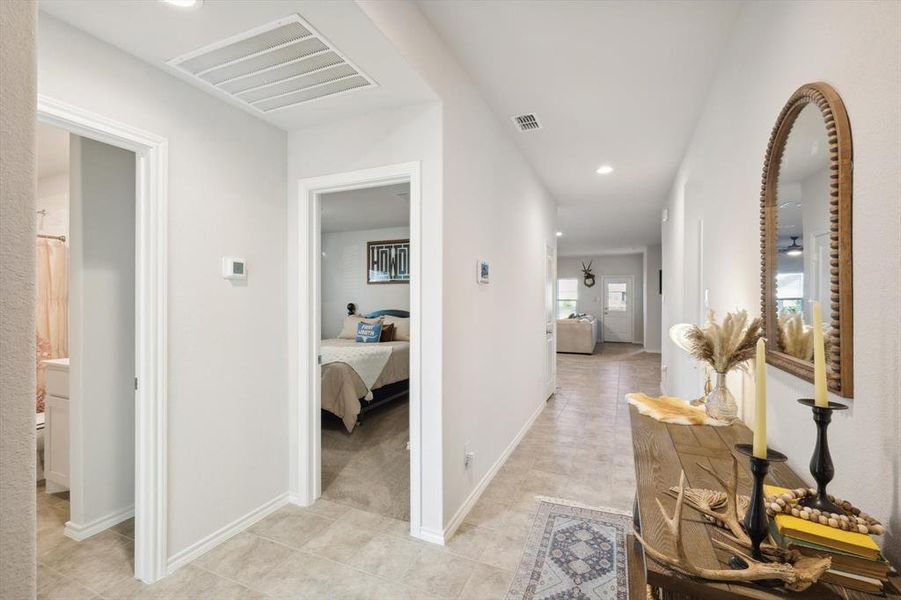 Hallway with light tile patterned floors