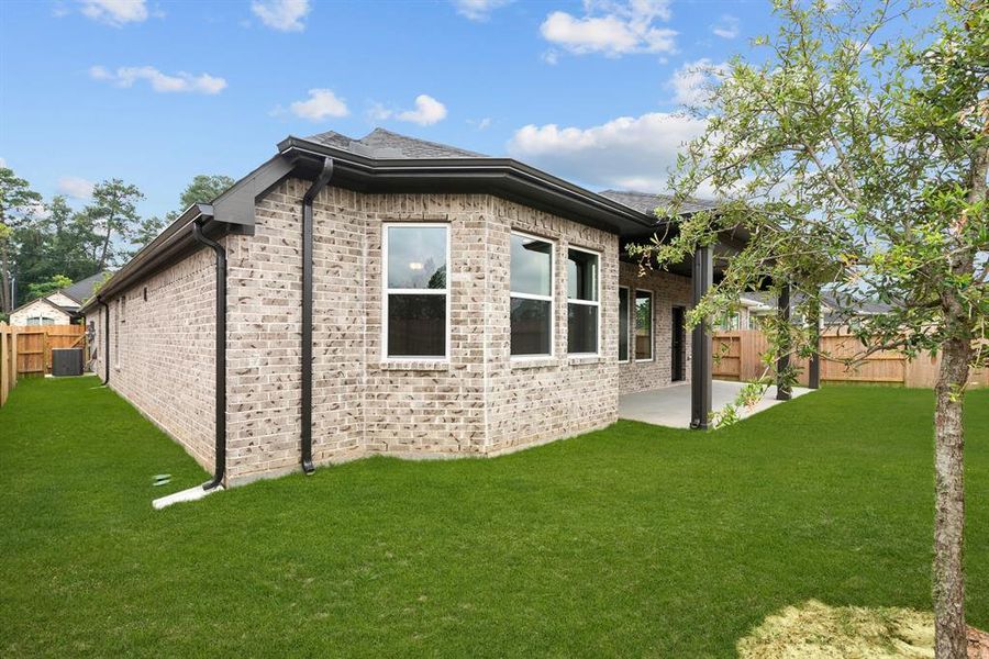 EXAMPLE PHOTO: All brick exterior with fully sodded and fenced lawn with full gutters and sprinklers