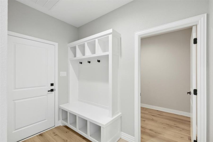 Unfurnished bedroom with light wood-type flooring, ceiling fan, and a closet