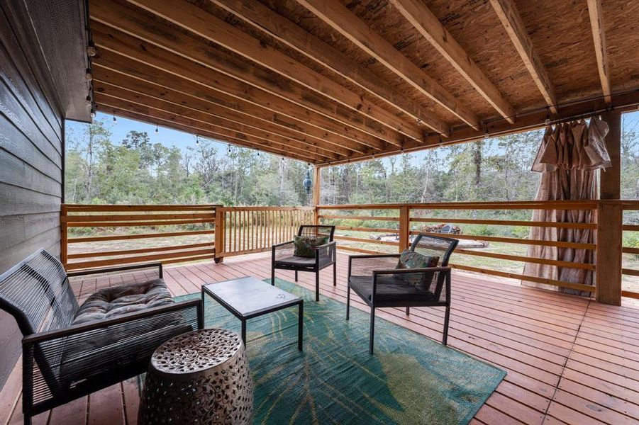 side porch with view of woods