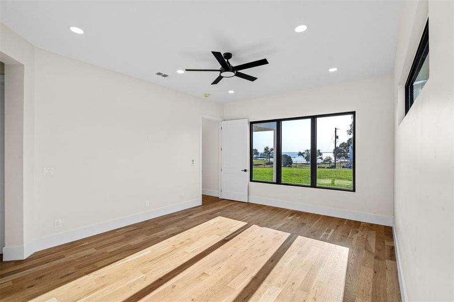 Unfurnished room with hardwood / wood-style floors and ceiling fan