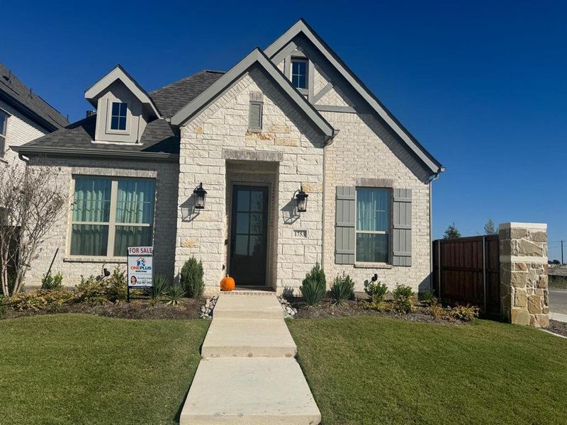 View of front of property with a front lawn