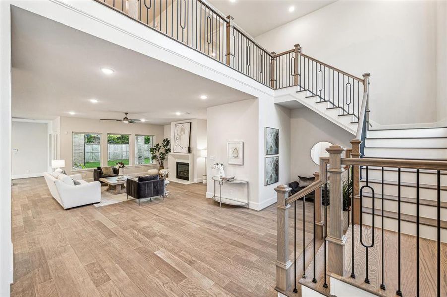 With its open layout and designer finishes, the foyer and wrap around staircase are the perfect introduction to the impeccable craftsmanship and attention to detail found throughout the rest of this home.