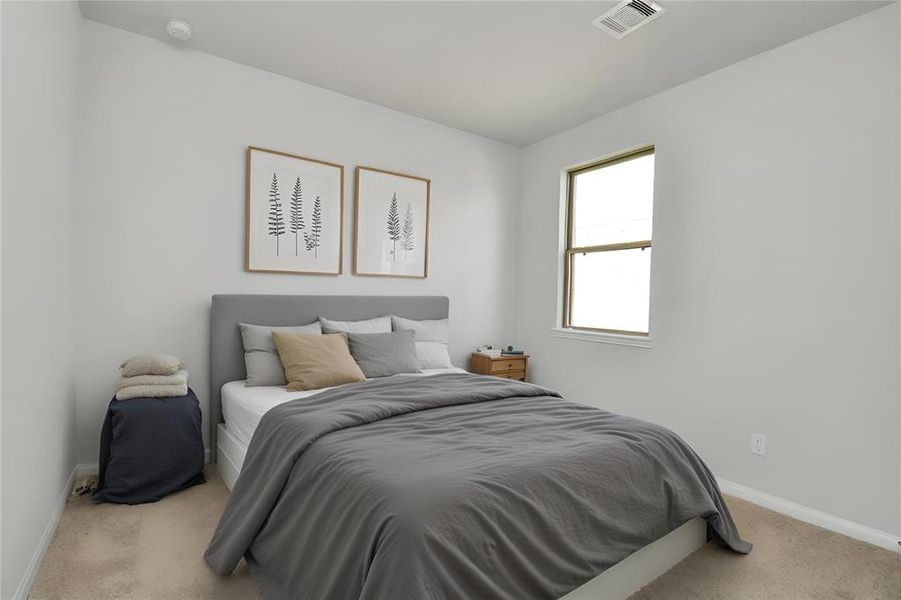 *Virtually Staged* Generously sized secondary bedrooms featuring spacious closets, soft and inviting carpeting underfoot and large windows allowing plenty of natural light.