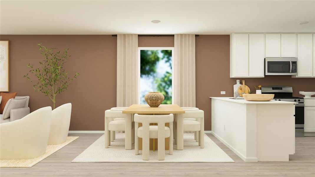 Dining space with light hardwood / wood-style flooring