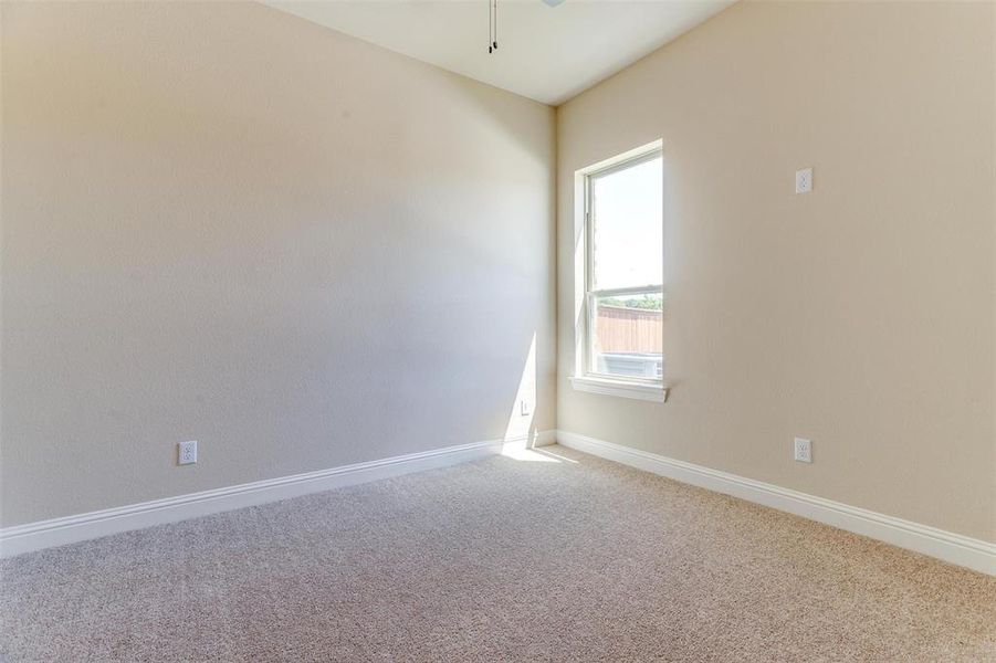 Spare room featuring carpet floors