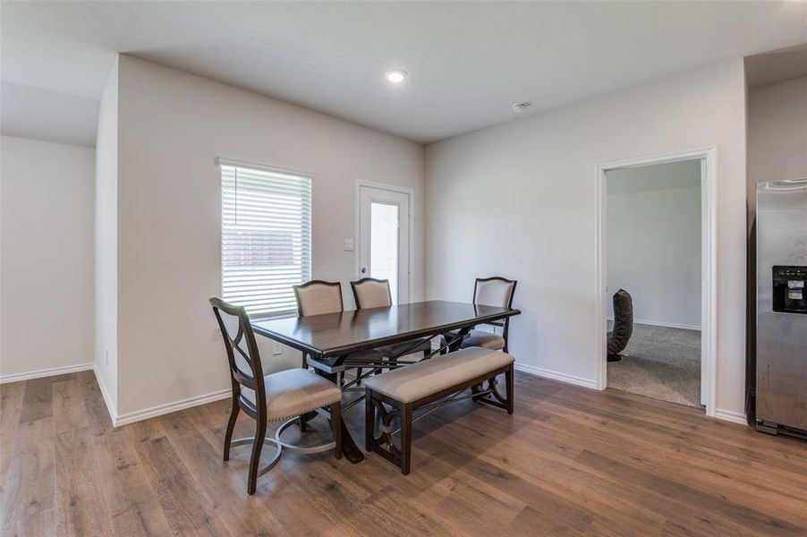 Dining room featuring dark wood-type flooring