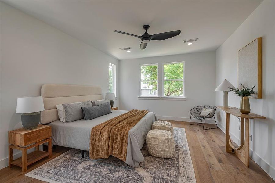 Bedroom featuring ceiling fan and light hardwood / wood-style flooring