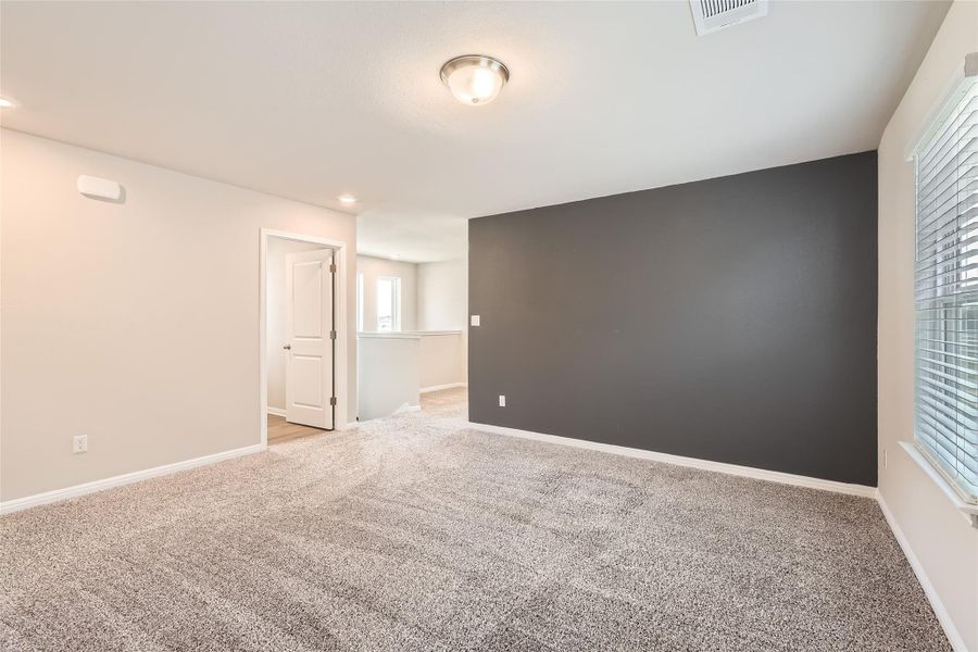 Upstairs the spacious game room provides excellent flexibility for use of space, perfect for an entertainment center, playroom, fitness equipment, and more.