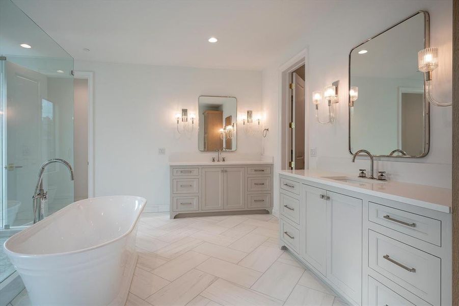 Bathroom with a tub to relax in and vanity