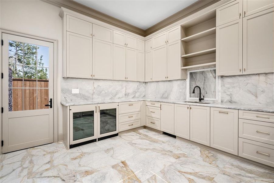 A large catering kitchen/butler's pantry adds exceptional storage and convenience while keeping the primary kitchen neat as a pin during formal gatherings.