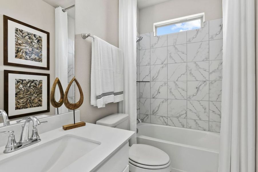 Bathroom in the Wimbledon home plan by Trophy Signature Homes – REPRESENTATIVE PHOTO
