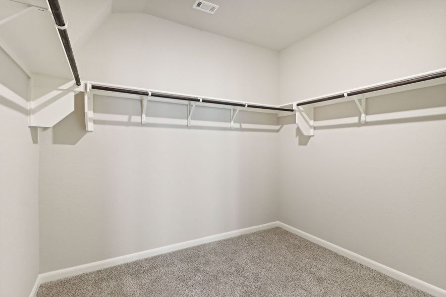 Primary suite walk-in closet in the Callaghan floorplan at a Meritage Homes community.