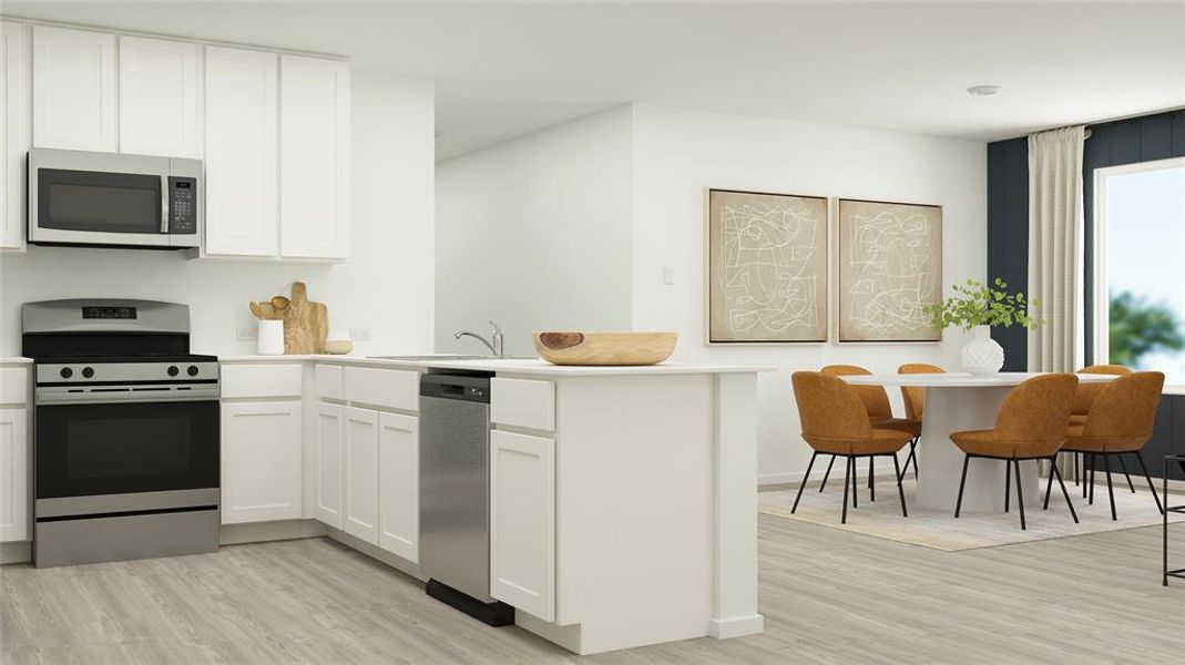 Kitchen with stainless steel appliances, kitchen peninsula, light wood-type flooring, and white cabinetry