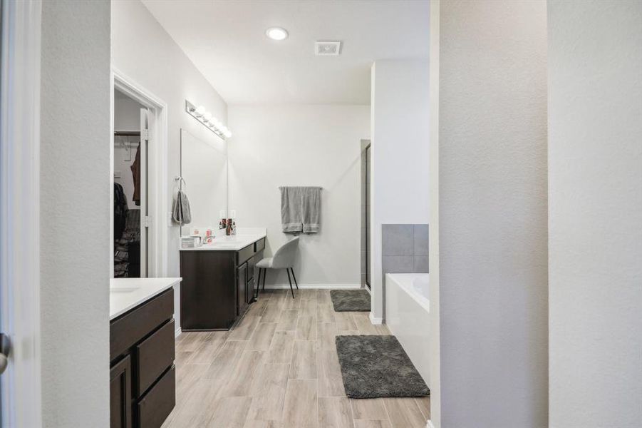 Primary bathroom with dual vanities